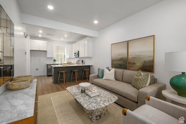 317 W Azure Sky Ln Unit 5-23, Salt Lake City, UT 84103 - living room with light wood-type flooring and recessed lighting