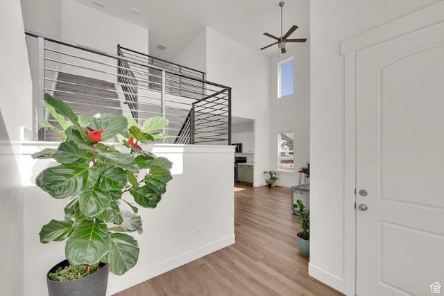 1293 N 3960 W Unit 457, Lehi, UT 84043 - foyer with a towering ceiling, stairs, wood finished floors, baseboards, and ceiling fan