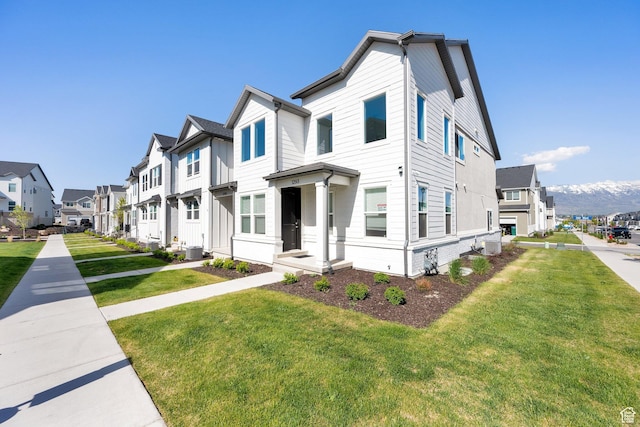 1293 N 3960 W Unit 457, Lehi, UT 84043 - view of property featuring a residential view, a front lawn, and cooling unit