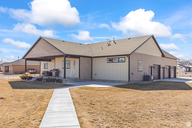 2201 S 380 W, Richfield, UT 84701 - view of front of house with a garage, board and batten siding, concrete driveway, and a front lawn