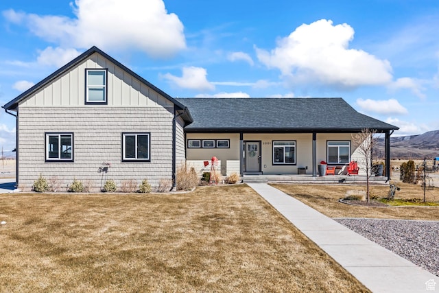 2201 S 380 W, Richfield, UT 84701 - view of front of house featuring a porch, board and batten siding, a front lawn, and a shingled roof