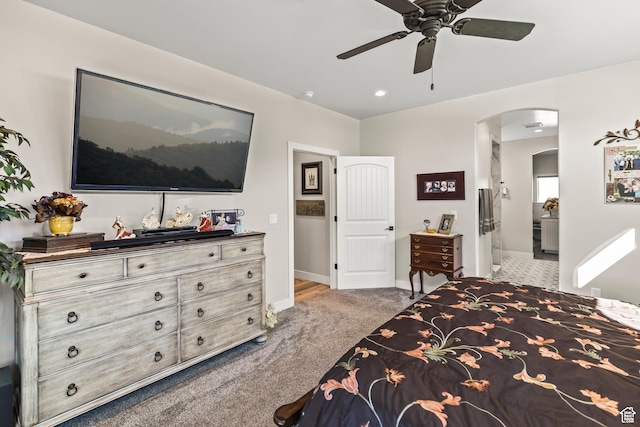 2201 S 380 W, Richfield, UT 84701 - bedroom with carpet flooring, arched walkways, baseboards, ensuite bathroom, and a ceiling fan
