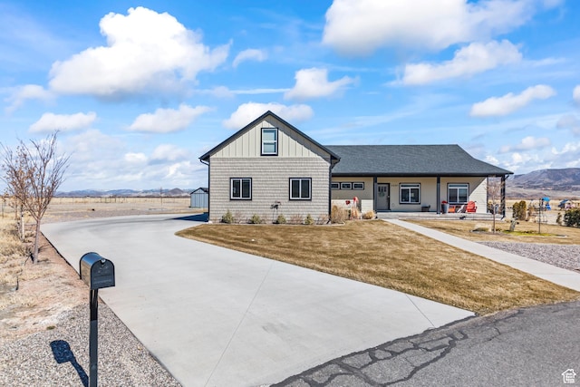 2201 S 380 W, Richfield, UT 84701 - view of front of house featuring a porch, a mountain view, a front lawn, and driveway