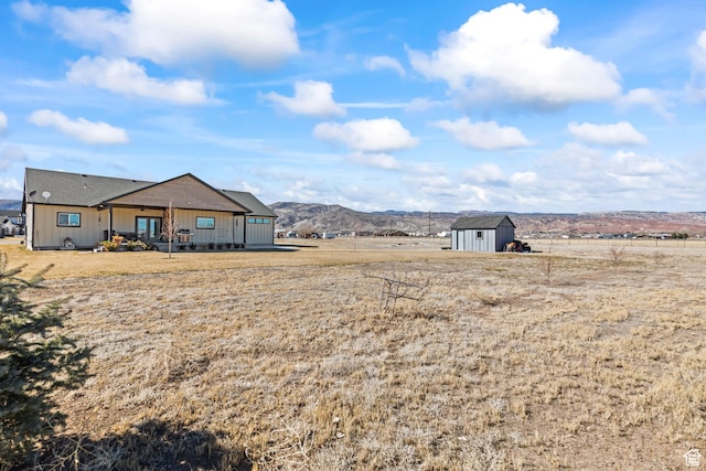 2201 S 380 W, Richfield, UT 84701 - view of yard with a storage unit, an outdoor structure, a view of countryside, and a mountain view