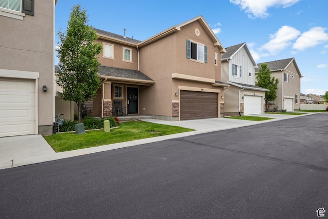 920 W Stonehaven Dr, North Salt Lake, UT 84054 - view of front facade with stucco siding, a residential view, an attached garage, and concrete driveway