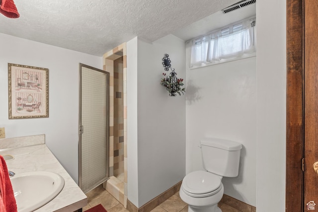 3647 Maple Creek Rd N, Franklin, ID 83237 - full bath featuring toilet, a stall shower, tile patterned floors, a textured ceiling, and vanity
