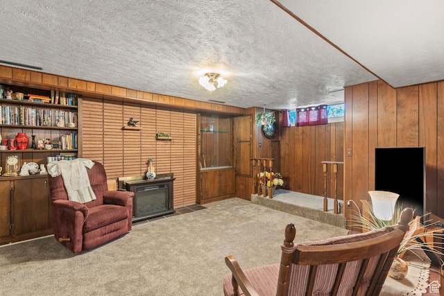 3647 Maple Creek Rd N, Franklin, ID 83237 - sitting room featuring wood walls, carpet, and a textured ceiling