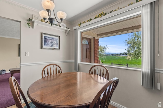 3647 Maple Creek Rd N, Franklin, ID 83237 - dining room with a chandelier, baseboards, and crown molding