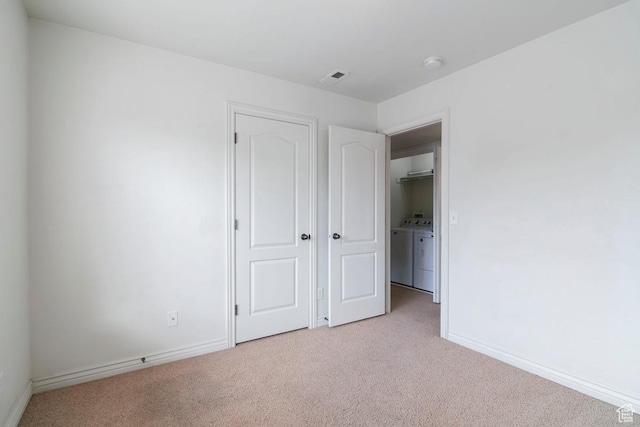 661 S 2220 W Unit 202, Pleasant Grove, UT 84062 - unfurnished bedroom with washer and dryer, light colored carpet, and baseboards