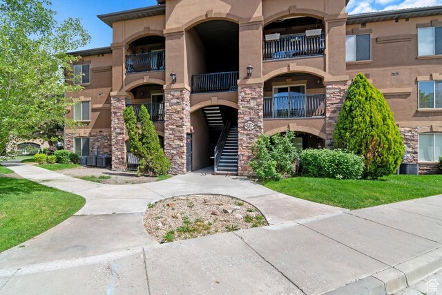 661 S 2220 W Unit 202, Pleasant Grove, UT 84062 - view of property featuring stairs and central AC