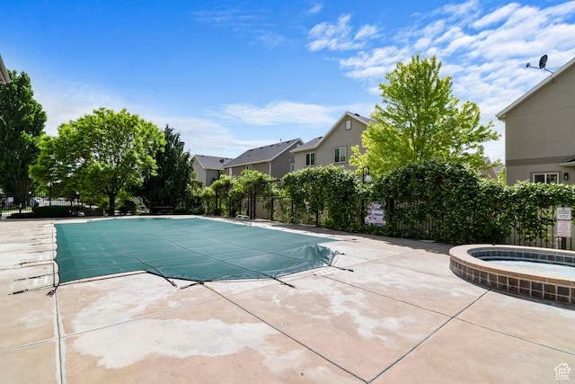 661 S 2220 W Unit 202, Pleasant Grove, UT 84062 - community pool featuring a hot tub, fence, and a patio area