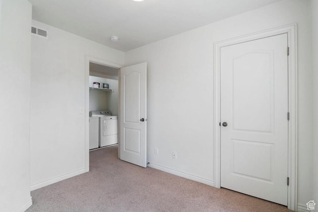 661 S 2220 W Unit 202, Pleasant Grove, UT 84062 - unfurnished bedroom with washing machine and dryer, light colored carpet, and baseboards