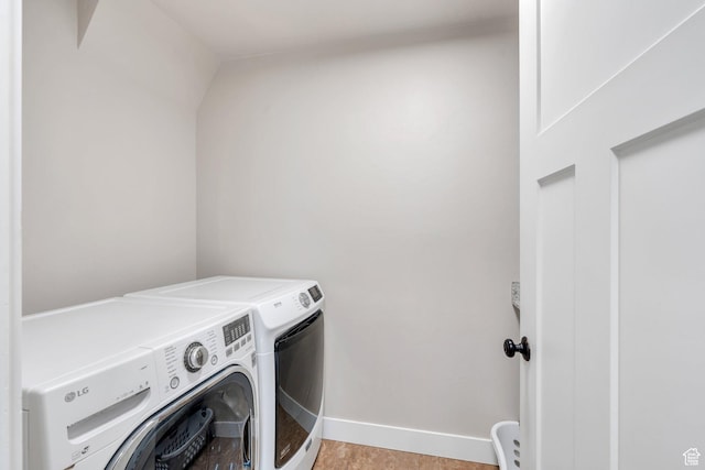 1565 E Smithfield Dr, Eagle Mountain, UT 84005 - clothes washing area featuring washer and dryer, baseboards, and light tile patterned floors