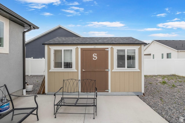 2256 E Boxwood Ln, Eagle Mountain, UT 84005 - entrance to property with a patio area, fence, and roof with shingles