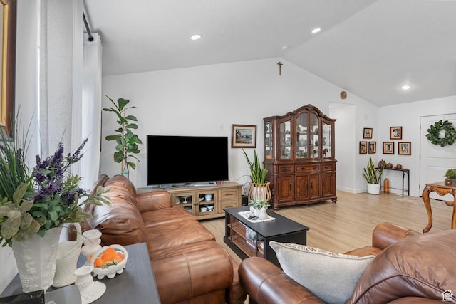 2256 E Boxwood Ln, Eagle Mountain, UT 84005 - living area with vaulted ceiling, light wood-style flooring, recessed lighting, and baseboards