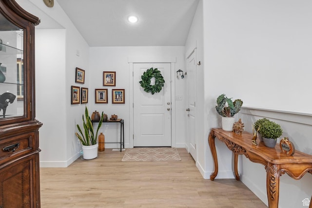 2256 E Boxwood Ln, Eagle Mountain, UT 84005 - foyer featuring light wood-style floors and baseboards