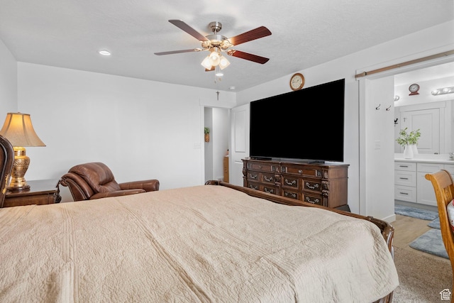 2256 E Boxwood Ln, Eagle Mountain, UT 84005 - bedroom with ensuite bath and ceiling fan
