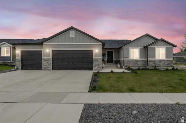 2256 E Boxwood Ln, Eagle Mountain, UT 84005 - view of front of property with a garage, stone siding, and board and batten siding