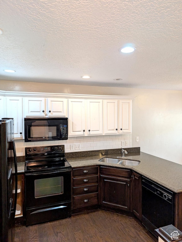266 W 1010 S, Logan, UT 84321 - kitchen featuring black appliances, a sink, white cabinetry, dark wood-type flooring, and dark countertops
