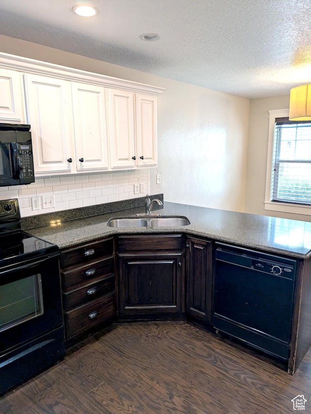 266 W 1010 S, Logan, UT 84321 - kitchen featuring black appliances, a sink, dark wood-style floors, white cabinetry, and dark countertops