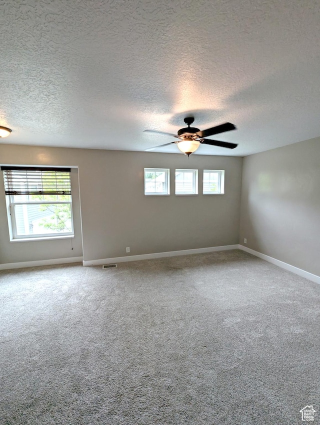 266 W 1010 S, Logan, UT 84321 - carpeted spare room with a textured ceiling, baseboards, and ceiling fan