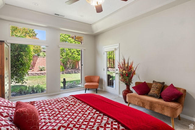 bedroom featuring carpet floors, multiple windows, and access to exterior