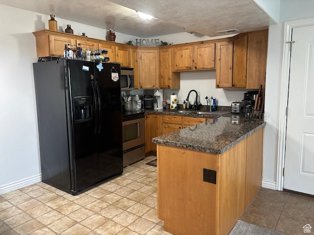 952 W 270 S Unit 202, Pleasant Grove, UT 84062 - kitchen featuring appliances with stainless steel finishes, a sink, a peninsula, brown cabinetry, and a textured ceiling