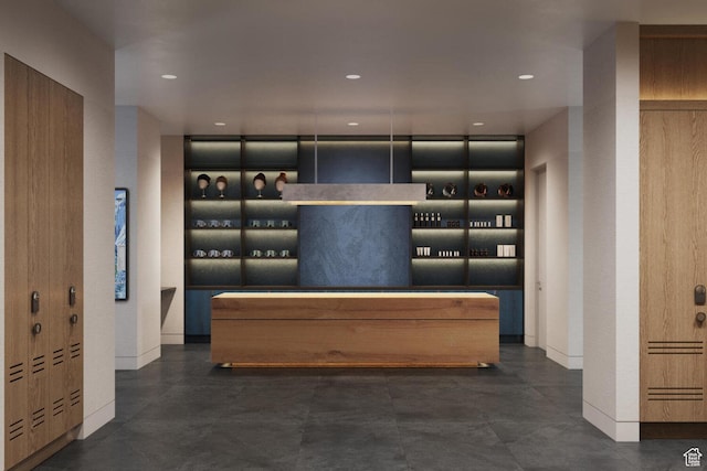 wine area featuring baseboards