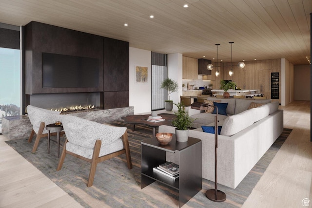 living room with wood ceiling, wood finished floors, recessed lighting, and a fireplace