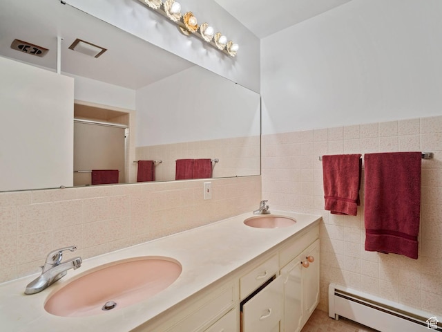 360 Crestview Dr, Park City, UT 84098 - full bath with a baseboard heating unit, a shower stall, double vanity, and tile walls