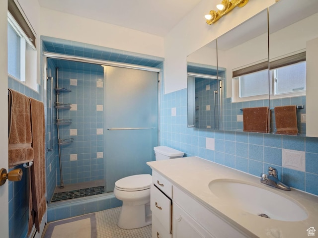 360 Crestview Dr, Park City, UT 84098 - bathroom featuring tile patterned flooring, tile walls, a shower stall, toilet, and vanity