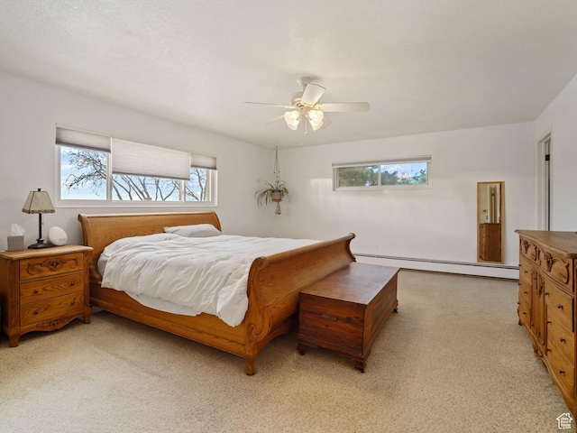 360 Crestview Dr, Park City, UT 84098 - bedroom with baseboard heating, multiple windows, light colored carpet, and ceiling fan