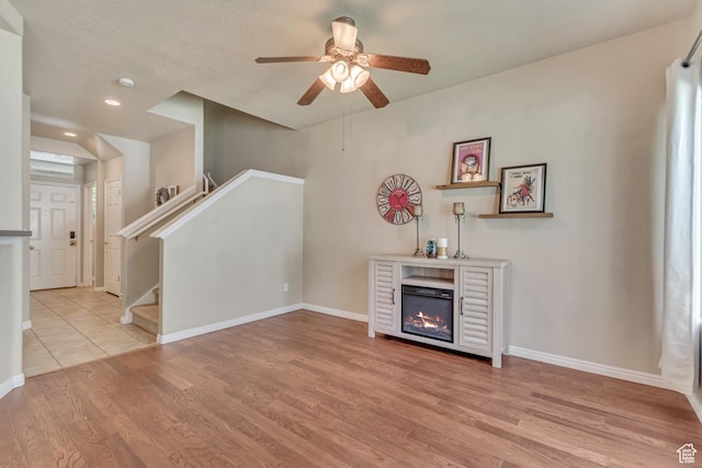 1524 W Napa Ave S, Bluffdale, UT 84065 - living area featuring wood finished floors, a ceiling fan, baseboards, a glass covered fireplace, and recessed lighting