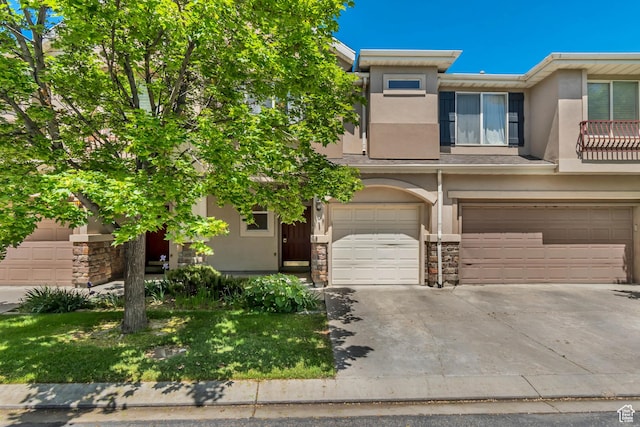 1524 W Napa Ave S, Bluffdale, UT 84065 - view of front of property featuring stucco siding, an attached garage, driveway, and stone siding
