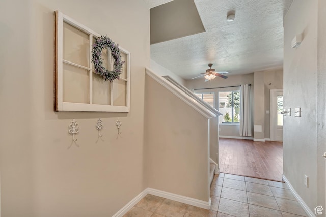 1524 W Napa Ave S, Bluffdale, UT 84065 - staircase with ceiling fan, baseboards, tile patterned floors, and a textured ceiling