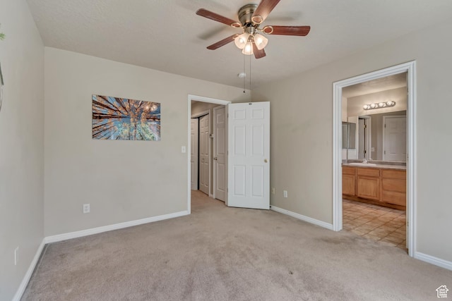 1524 W Napa Ave S, Bluffdale, UT 84065 - unfurnished bedroom featuring light carpet, baseboards, a sink, and connected bathroom