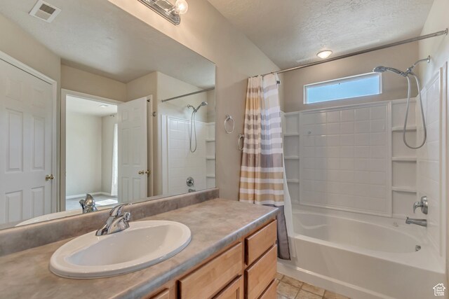 1524 W Napa Ave S, Bluffdale, UT 84065 - full bathroom with shower / tub combo with curtain, a textured ceiling, vanity, and tile patterned floors