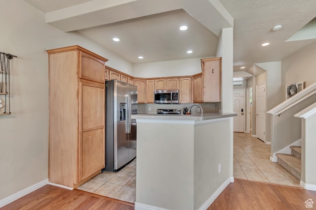 1524 W Napa Ave S, Bluffdale, UT 84065 - kitchen featuring appliances with stainless steel finishes, a peninsula, recessed lighting, baseboards, and light tile patterned flooring