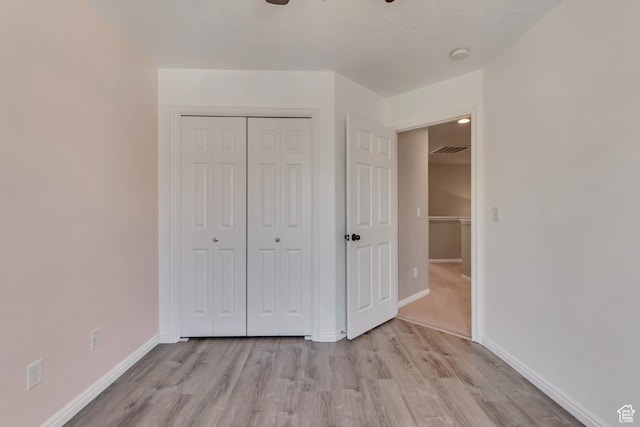 1524 W Napa Ave S, Bluffdale, UT 84065 - unfurnished bedroom featuring light wood-style flooring, baseboards, and a closet