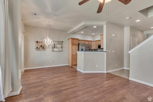 1524 W Napa Ave S, Bluffdale, UT 84065 - unfurnished living room with ceiling fan, light wood finished floors, a chandelier, recessed lighting, and baseboards