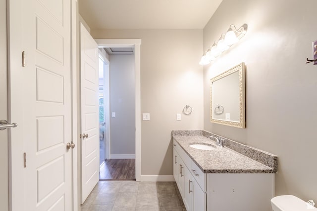 1517 E Kelsey Dr, Eagle Mountain, UT 84005 - half bath with vanity, tile patterned floors, baseboards, and toilet