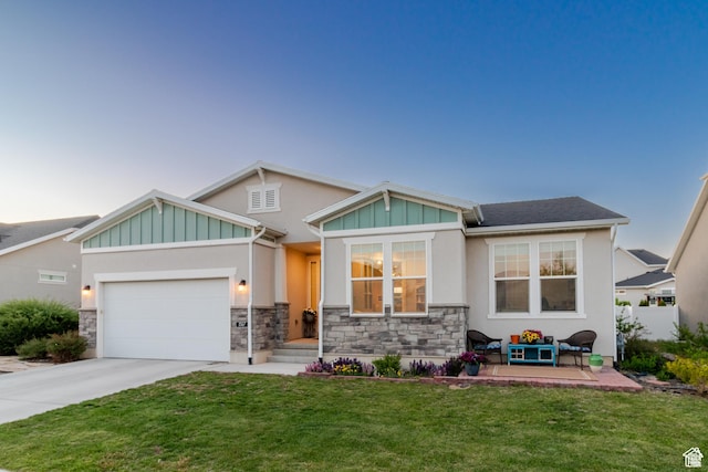 1517 E Kelsey Dr, Eagle Mountain, UT 84005 - craftsman inspired home featuring an attached garage, driveway, a front lawn, board and batten siding, and stone siding