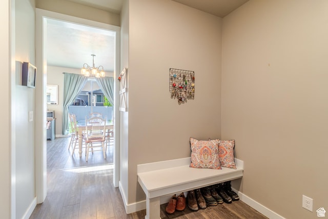 1517 E Kelsey Dr, Eagle Mountain, UT 84005 - mudroom featuring a chandelier, wood finished floors, and baseboards