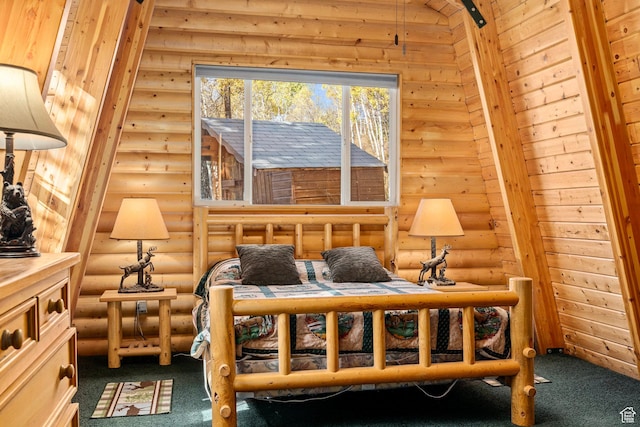living area with log walls and carpet flooring