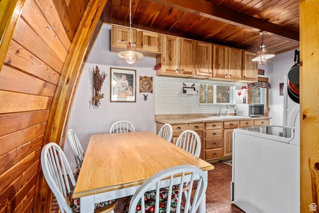 dining room featuring wooden ceiling and beamed ceiling