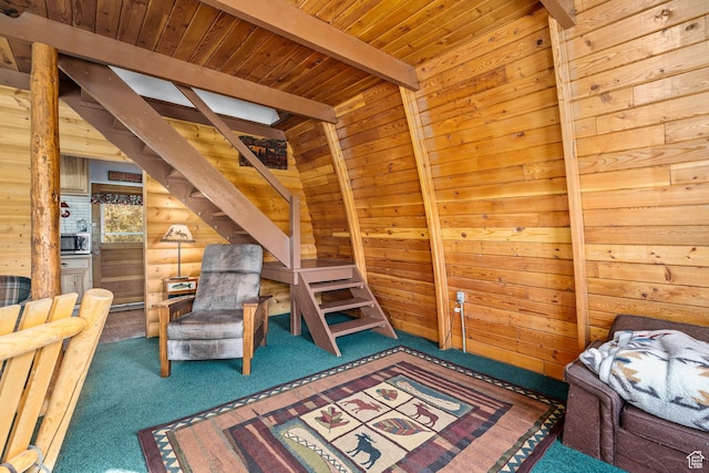 carpeted bedroom featuring beamed ceiling, wood ceiling, and wood walls