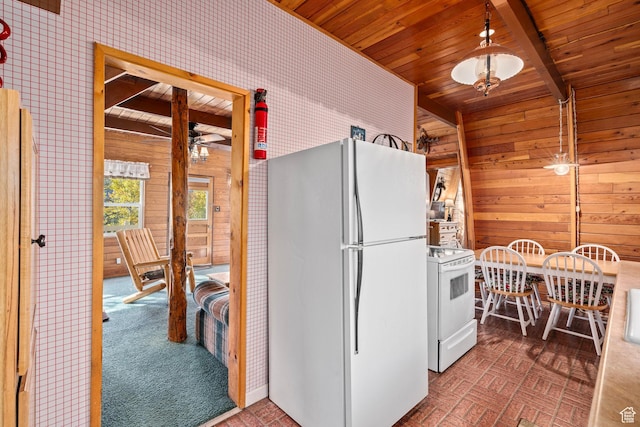 kitchen with white appliances, wood ceiling, wooden walls, ceiling fan, and wallpapered walls