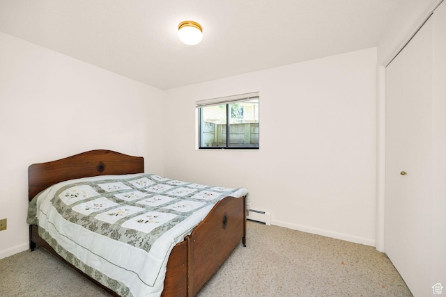 1729 N 1700 E, North Logan, UT 84341 - bedroom featuring baseboard heating, light carpet, baseboards, and a closet