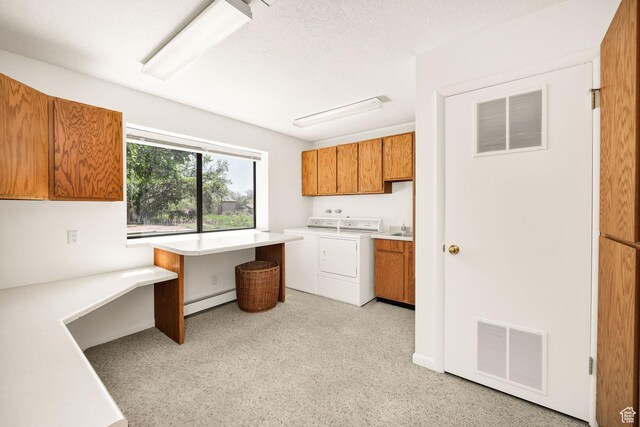 1729 N 1700 E, North Logan, UT 84341 - clothes washing area with cabinet space, baseboard heating, washing machine and clothes dryer, and an office area