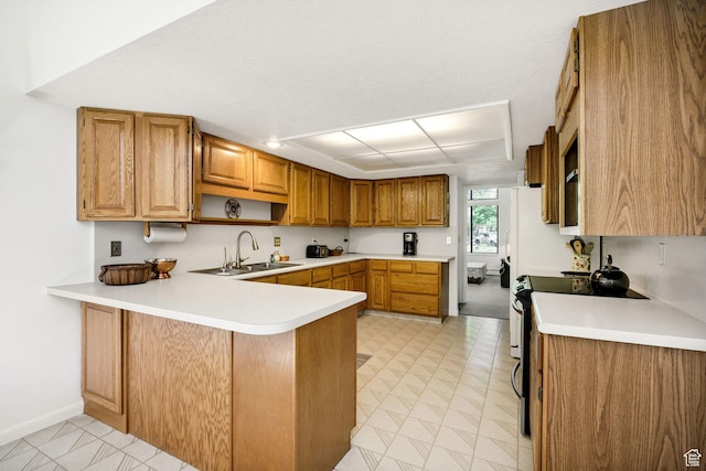 1729 N 1700 E, North Logan, UT 84341 - kitchen with a sink, a peninsula, light countertops, and stainless steel range with electric stovetop